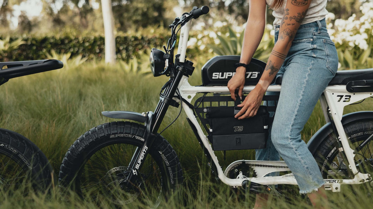 Woman riding a Super73 Bone White in the nature