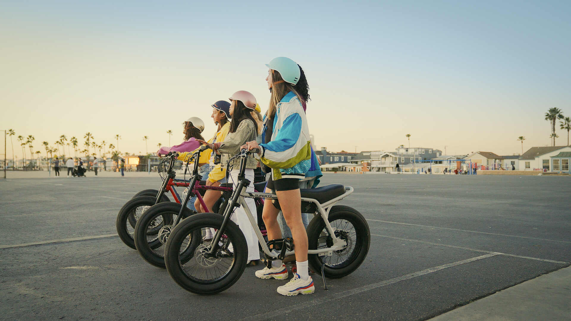 A group of girls getting ready to ride their Super73-Z Miami ebikes