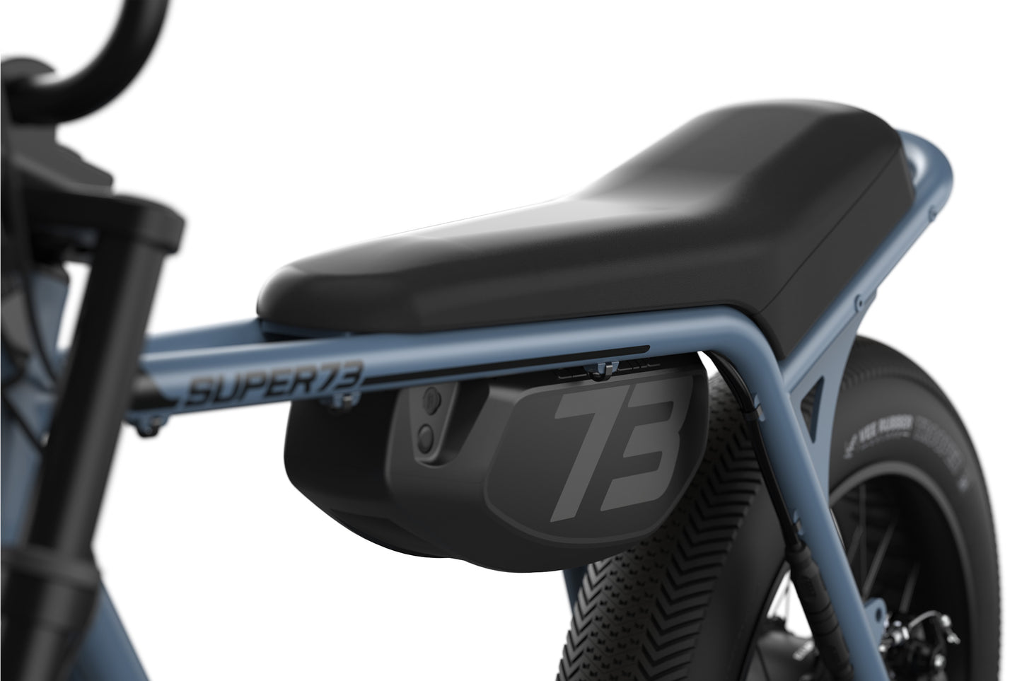 Close-up of a motorcycle seat with &#39;Super73&#39; branding on a white background