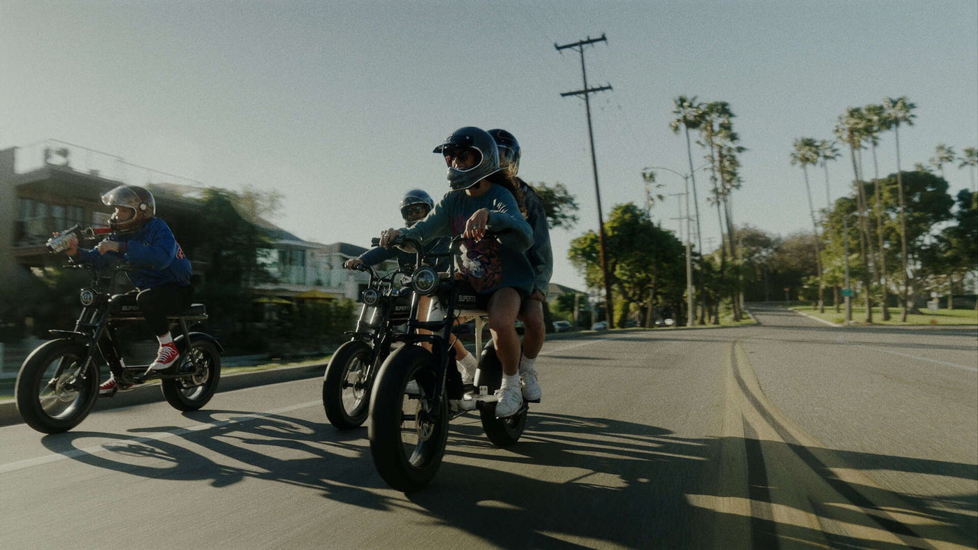 A group of people riding Super73 ebikes on the streets of L.A.