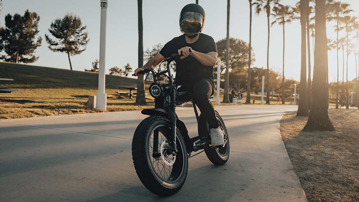 Young man riding a SUPER73-S series ebike showing upright ergonomics