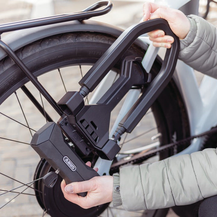 detail shot of ABUS GRANIT Super Extreme Lock installation on bike