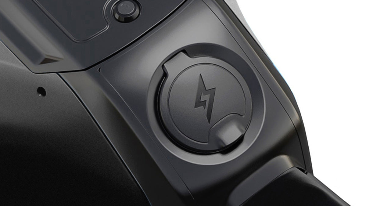Close-up studio image of the charging port on the C1X bike