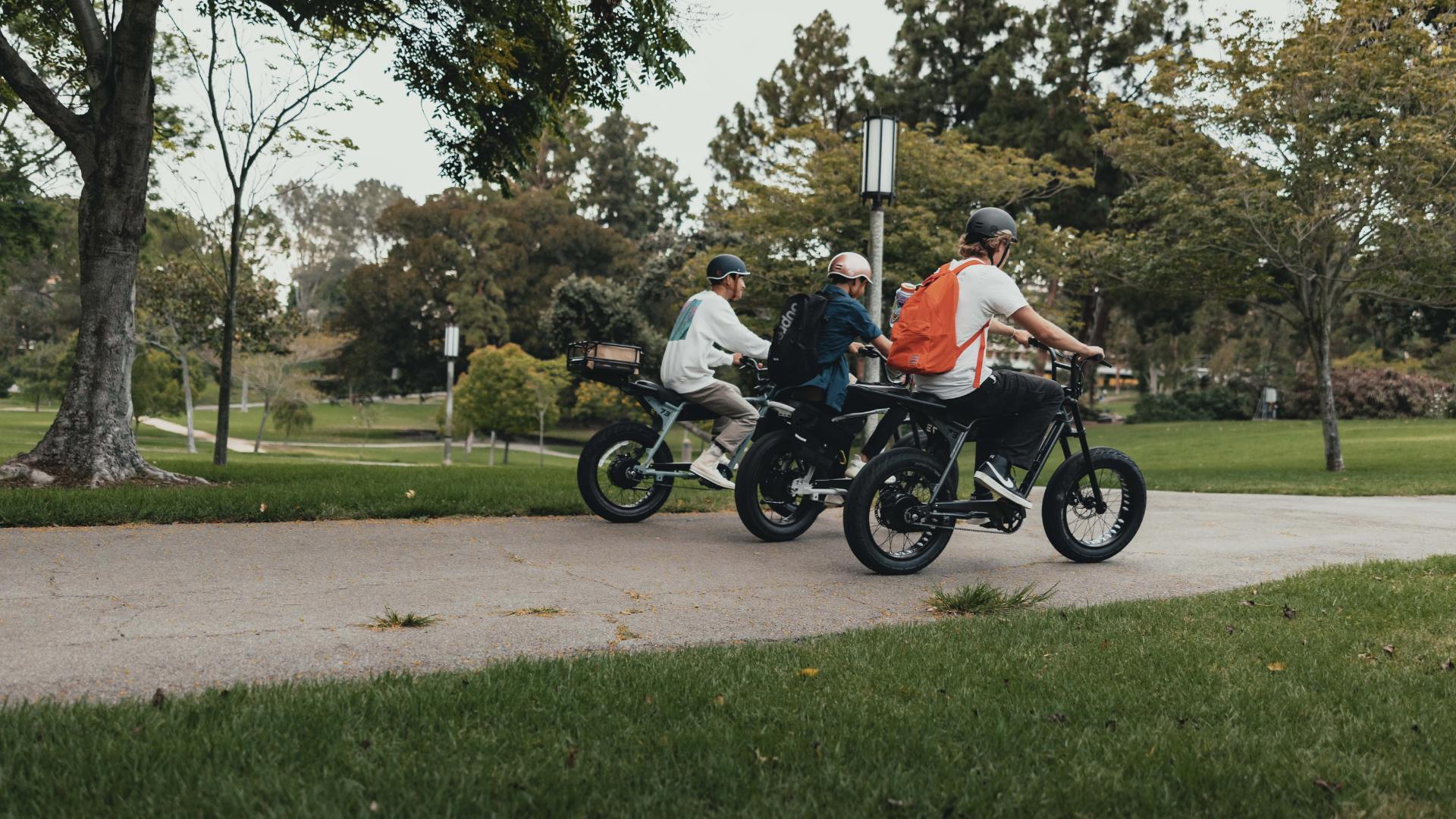 Three guys riding in the park their Super73 ebikes