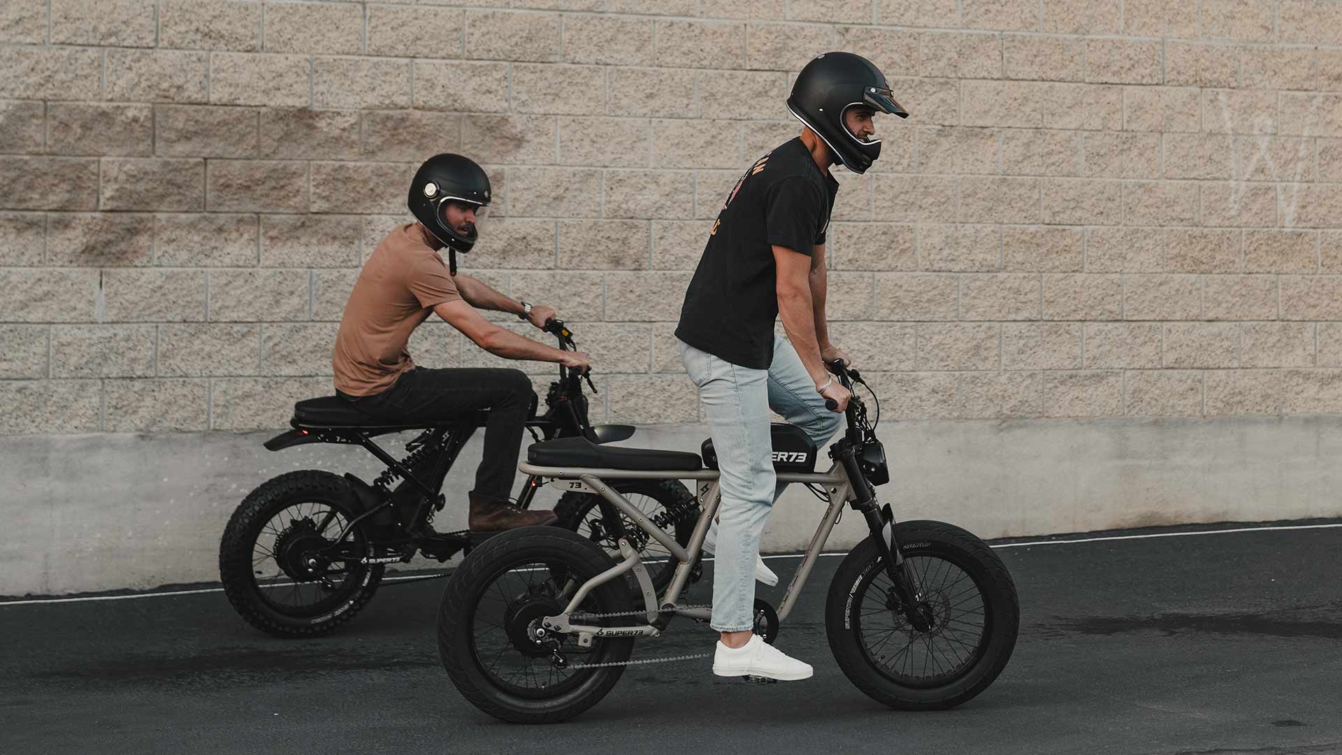 Two men riding Super73 ebikes 