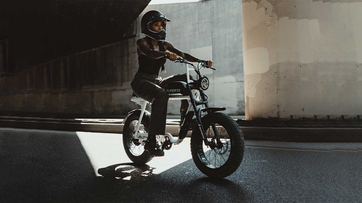 Woman riding on a Super73-S2 Bone White