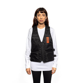 Model wearing a Super73 and Field Research Division Collection Mule Vest